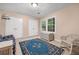 Cozy bedroom with natural light, plush rug, and ample storage space with a decorative throw blanket at 837 Pine Ridge Dr, Lawrenceville, GA 30043
