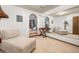 Bedroom featuring neutral walls, mirror, chaise lounge, and view into adjacent space at 837 Pine Ridge Dr, Lawrenceville, GA 30043