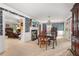 Elegant dining room featuring decorative wallpaper, fireplace, and chandelier at 837 Pine Ridge Dr, Lawrenceville, GA 30043