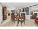 Elegant dining room with chandelier, decorative wallpaper, and view into other rooms at 837 Pine Ridge Dr, Lawrenceville, GA 30043