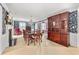 Elegant dining room with chandelier, decorative wallpaper, and large display cabinet at 837 Pine Ridge Dr, Lawrenceville, GA 30043