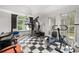 Bright exercise room with checkered floors, large windows, and modern fitness equipment at 837 Pine Ridge Dr, Lawrenceville, GA 30043