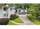 View of the home's exterior showing a well-maintained lawn and attached garage with a bonus room above at 837 Pine Ridge Dr, Lawrenceville, GA 30043