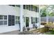 Charming front porch with rocking chairs, a wreath on the door, and black shutters at 837 Pine Ridge Dr, Lawrenceville, GA 30043