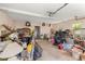 Spacious and cluttered garage offering ample storage potential with natural light from windows at 837 Pine Ridge Dr, Lawrenceville, GA 30043