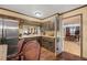 Bright kitchen with dark wood cabinets and adjacent dining area at 837 Pine Ridge Dr, Lawrenceville, GA 30043