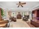 Bright living room features access to outdoors and custom built-ins at 837 Pine Ridge Dr, Lawrenceville, GA 30043