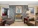 Stone fireplace is the focal point of this well-appointed living room at 837 Pine Ridge Dr, Lawrenceville, GA 30043