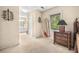 Neutral-toned main bedroom showcasing a hanging chair and an ensuite bathroom at 837 Pine Ridge Dr, Lawrenceville, GA 30043