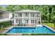 Inviting pool area with manicured lawn and comfortable lounge chairs for relaxation and enjoying the outdoors at 837 Pine Ridge Dr, Lawrenceville, GA 30043