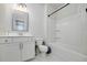 Bright bathroom featuring white cabinets, modern fixtures, and a shower-tub combination at 9117 Hanover St, Lithia Springs, GA 30122
