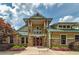 Exterior facade of the community activity center with stone accents and well-maintained landscaping at 9117 Hanover St, Lithia Springs, GA 30122