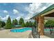 A view of the outdoor community pool with lounge chairs for residents at 9117 Hanover St, Lithia Springs, GA 30122