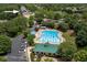 Aerial of the community pool featuring clear blue water and a lounge area with shade at 9117 Hanover St, Lithia Springs, GA 30122