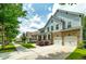 Beautiful two-story home featuring stone accents, a two-car garage, and a spacious driveway at 9117 Hanover St, Lithia Springs, GA 30122