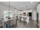 Kitchen features white cabinets, stainless appliances, and a breakfast bar seating at 9117 Hanover St, Lithia Springs, GA 30122