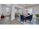 Bright living room with dining area featuring modern furniture, stylish decor, and plenty of natural light at 9117 Hanover St, Lithia Springs, GA 30122