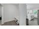 Hallway with a built in bench, shoe rack, and coat hooks at 9117 Hanover St, Lithia Springs, GA 30122
