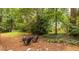 Backyard area featuring fire pit and outdoor seating at 1236 S Shadygrove Ct, Stone Mountain, GA 30083