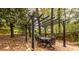 Backyard patio with outdoor dining table beneath a pergola at 1236 S Shadygrove Ct, Stone Mountain, GA 30083