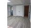 Finished basement with gray flooring, neutral paint, recessed lights and multiple entries for easy access at 1236 S Shadygrove Ct, Stone Mountain, GA 30083