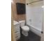 This bathroom has a granite countertop, a white vanity, and a dark medicine cabinet at 1236 S Shadygrove Ct, Stone Mountain, GA 30083