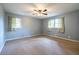Bedroom with carpeting, two windows, and ceiling fan at 1236 S Shadygrove Ct, Stone Mountain, GA 30083