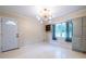 A dining room featuring an atomic style light fixture and large window providing ample natural light at 1236 S Shadygrove Ct, Stone Mountain, GA 30083