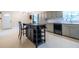 Functional kitchen with light grey cabinets, updated appliances, and a central island at 1236 S Shadygrove Ct, Stone Mountain, GA 30083