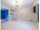Open-concept kitchen/dining area with modern chandelier, neutral walls, and a functional island at 1236 S Shadygrove Ct, Stone Mountain, GA 30083