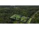 Aerial view of a wooded lot with property lines highlighted, near Lake Dow, offering privacy and seclusion at 820 Airline Rd, Mcdonough, GA 30252