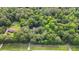 Aerial view of a wooded lot with mature trees, offering a private and serene setting near the road at 820 Airline Rd, Mcdonough, GA 30252
