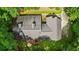 Aerial view of the home nestled in a lush, green, heavily wooded area at 820 Airline Rd, Mcdonough, GA 30252