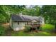 Overhead view showing home's backyard with deck, complemented by mature trees and greenery at 820 Airline Rd, Mcdonough, GA 30252