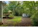 Large backyard features deck, shed, and mature trees at 820 Airline Rd, Mcdonough, GA 30252
