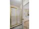 Bathroom with glass enclosed shower, tile flooring and soaking tub at 820 Airline Rd, Mcdonough, GA 30252