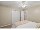 Neutral bedroom featuring soft carpet, closet and ceiling fan at 820 Airline Rd, Mcdonough, GA 30252