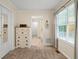 Neutral bedroom has plush carpet, a white dresser and lots of natural light from the window at 820 Airline Rd, Mcdonough, GA 30252