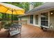 Outdoor deck with ample seating and table, offering a great space for dining and relaxation at 820 Airline Rd, Mcdonough, GA 30252