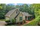 Beautiful home exterior with a garage, inviting front porch, and well-manicured landscaping at 820 Airline Rd, Mcdonough, GA 30252