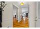 View of foyer featuring hardwood floors leading to an open living area with natural light and neutral walls at 820 Airline Rd, Mcdonough, GA 30252