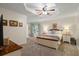Cozy main bedroom featuring a tray ceiling, soft carpet, and neutral decor at 820 Airline Rd, Mcdonough, GA 30252