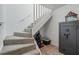 Carpeted stairway with white railing, leading to the upper level at 820 Airline Rd, Mcdonough, GA 30252