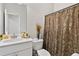 Bathroom with shower, commode, and single vanity at 140 Canyons Ct, Hampton, GA 30228
