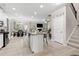 Open-concept kitchen with a large island, stainless steel appliances, and modern finishes at 140 Canyons Ct, Hampton, GA 30228