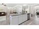 Bright kitchen with a large island, modern appliances, granite countertops, and an open floor plan at 140 Canyons Ct, Hampton, GA 30228