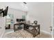 Modern office space with dual workstations, ample natural light, and neutral decor at 140 Canyons Ct, Hampton, GA 30228