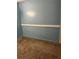 Carpeted bedroom with blue walls at 1455 Stone Mill Trce, Stone Mountain, GA 30083