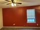 Bedroom featuring a ceiling fan, window with blinds, and neutral carpet at 1455 Stone Mill Trce, Stone Mountain, GA 30083