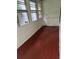 Enclosed porch with paneled walls and red painted wooden floor at 1455 Stone Mill Trce, Stone Mountain, GA 30083